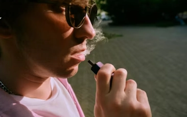 a man smoking a vape