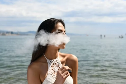 a woman smoking a vape