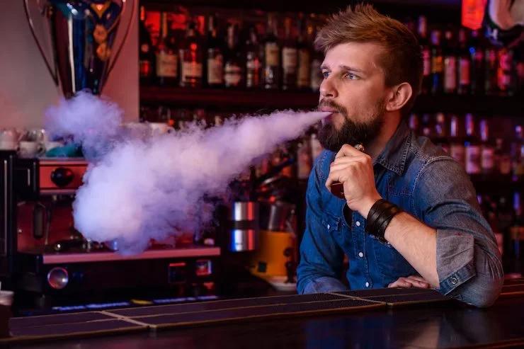 vape-vaping-man-cloud-vapor-photo-is-taken-vape-bar-vape-shop_639032-351