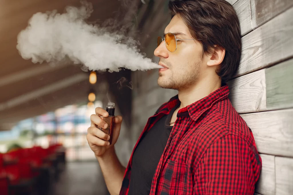 1.stylish-elegant-man-city-with-vape
